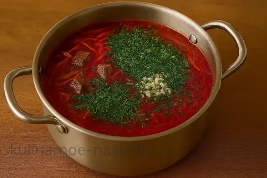 Красный борщ с мясом - шаг 7. Добавление чеснока и зелени